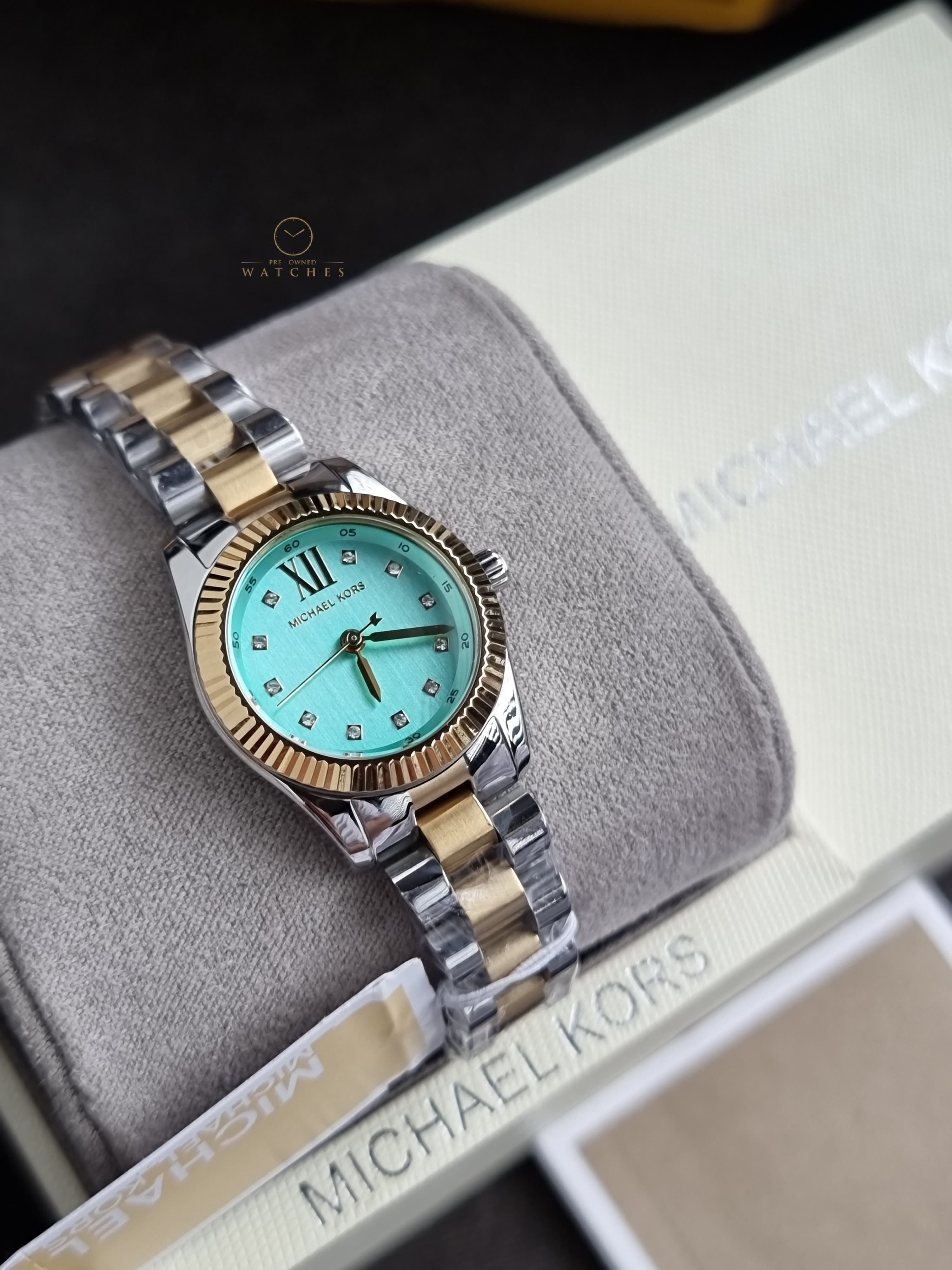Michael Kors Petite Lexington 26mm Turquoise Dial Two Tone Stainless Steel Bracelet Watch
 MK7579