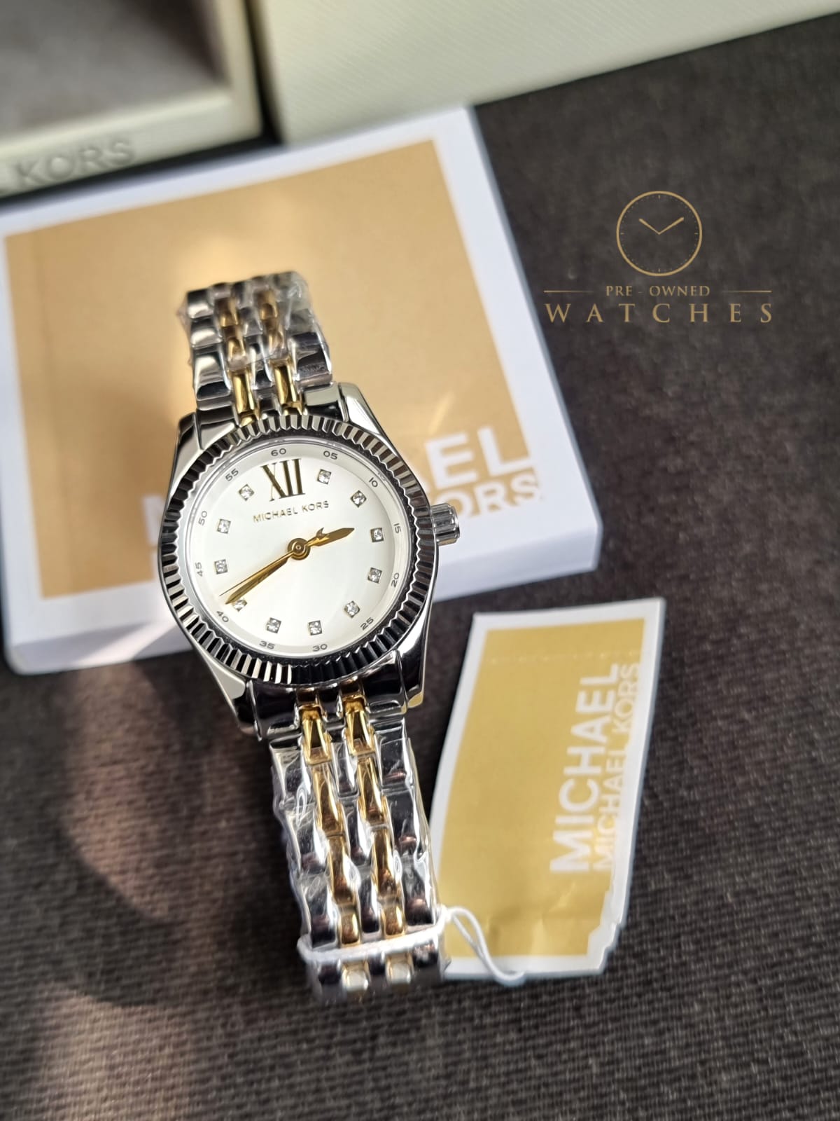 Michael Kors 
Lexington Quartz Crystal White Dial Two-Tone Ladies Watch
MK4740
