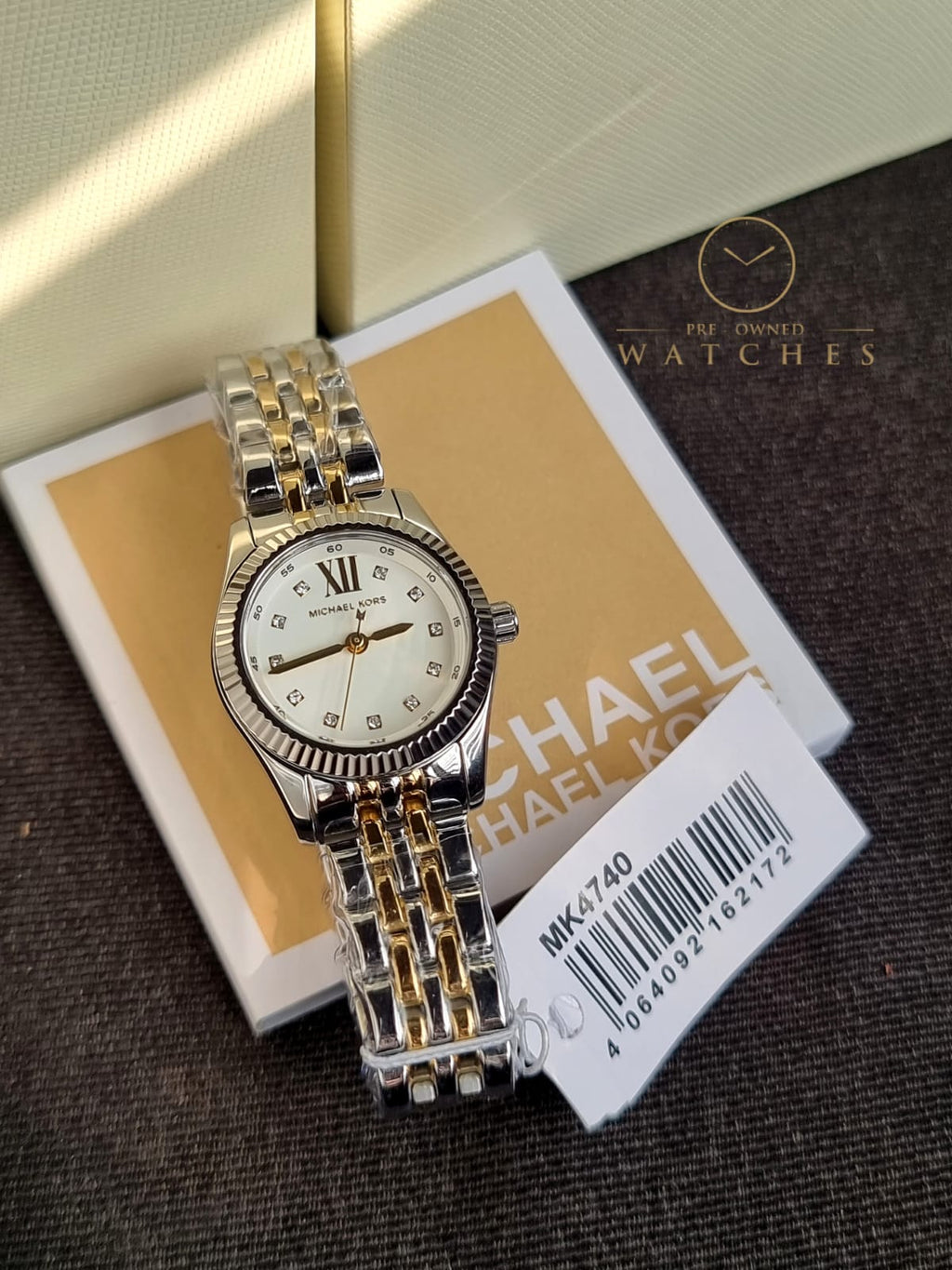 Michael Kors 
Lexington Quartz Crystal White Dial Two-Tone Ladies Watch
MK4740