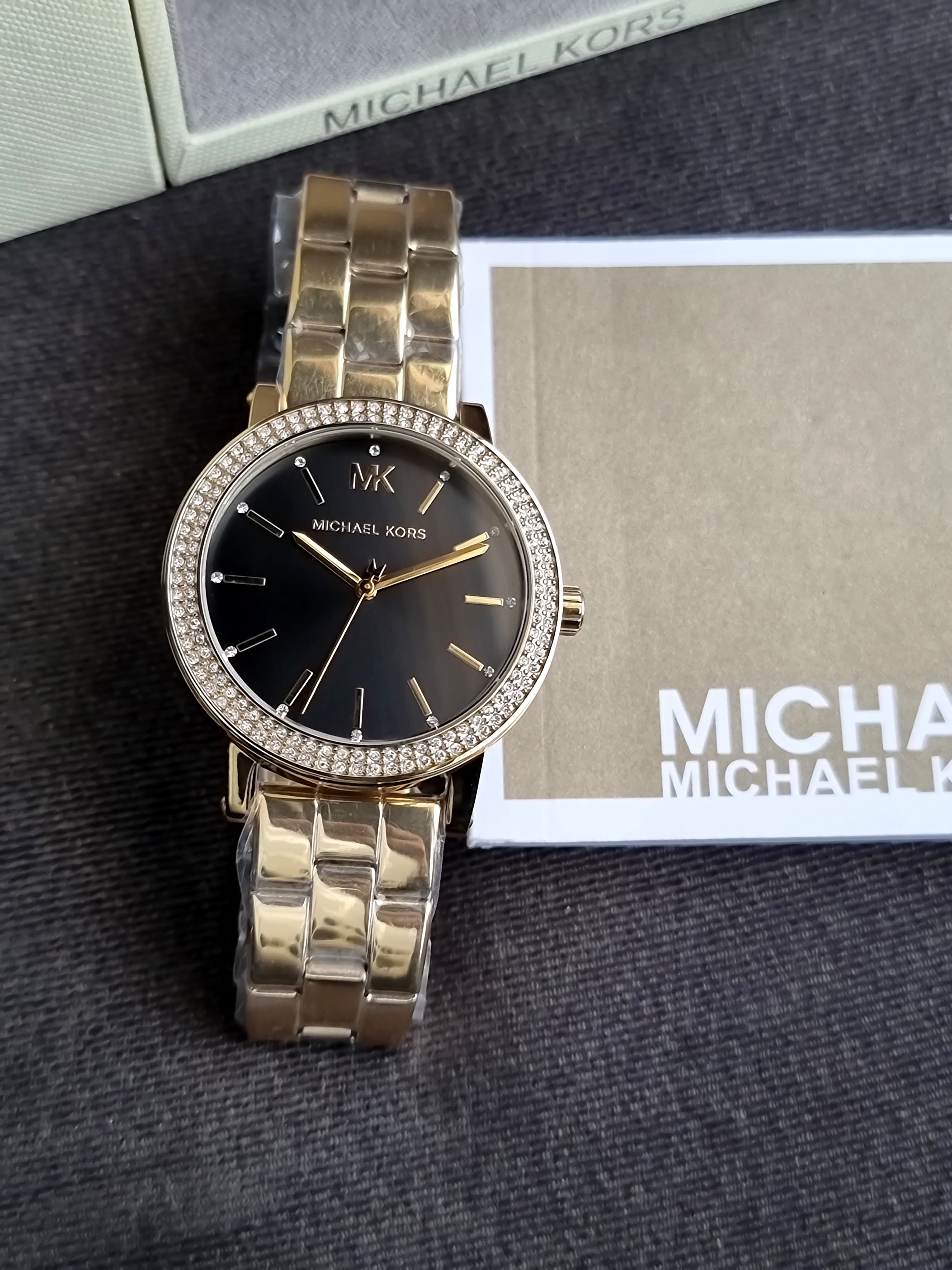 Michael Kors Women's Corey Three-Hand Gold-Tone Stainless Steel 38mm Watch 
MK7547