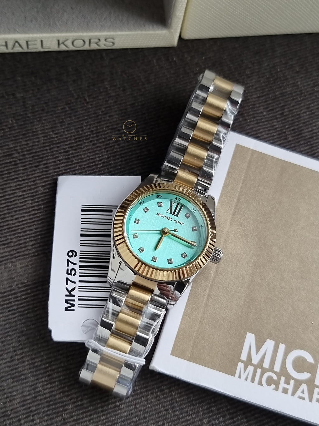 Michael Kors Petite Lexington 26mm Turquoise Dial Two Tone Stainless Steel Bracelet Watch
 MK7579