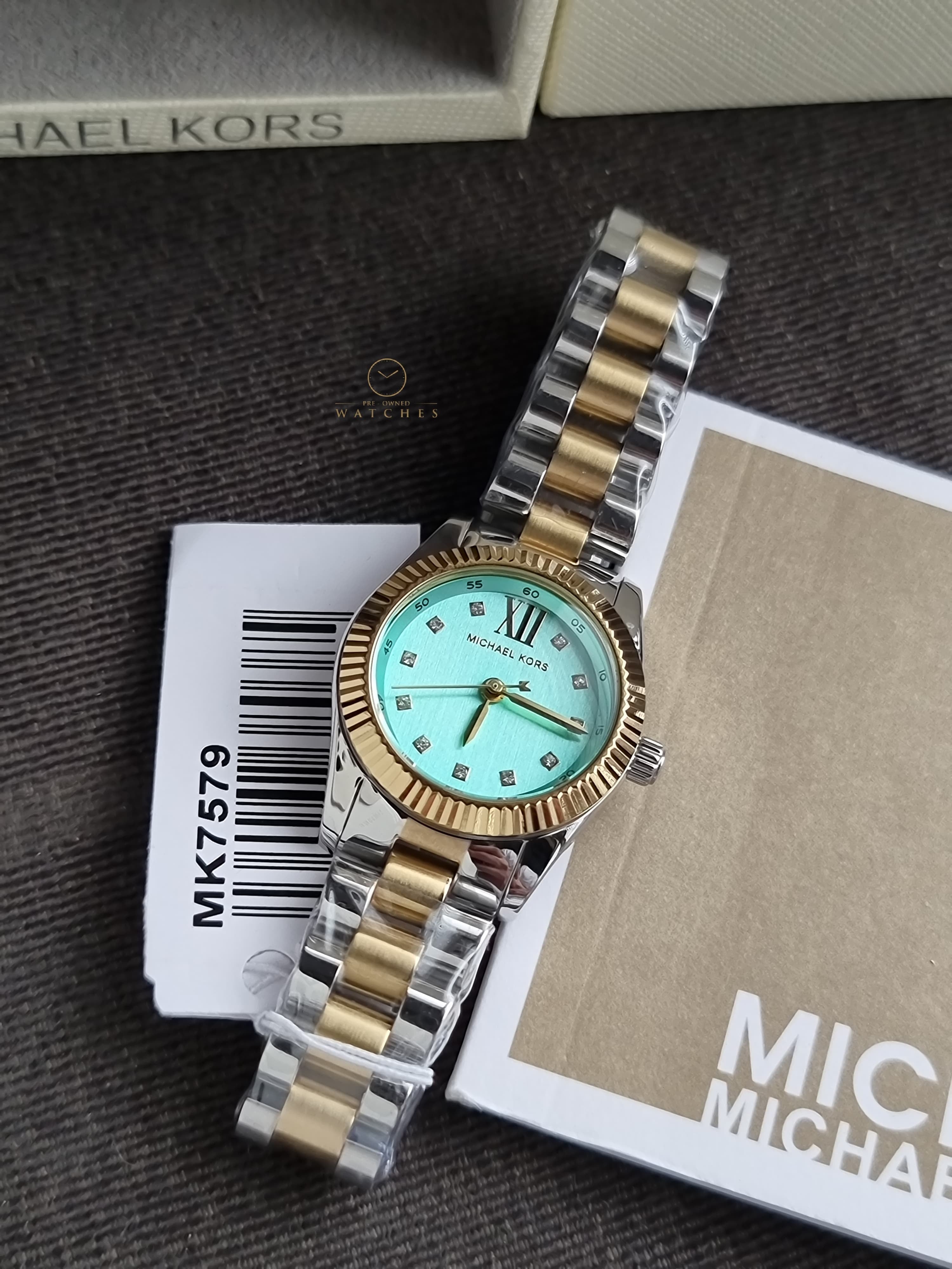 Michael Kors Petite Lexington 26mm Turquoise Dial Two Tone Stainless Steel Bracelet Watch
 MK7579