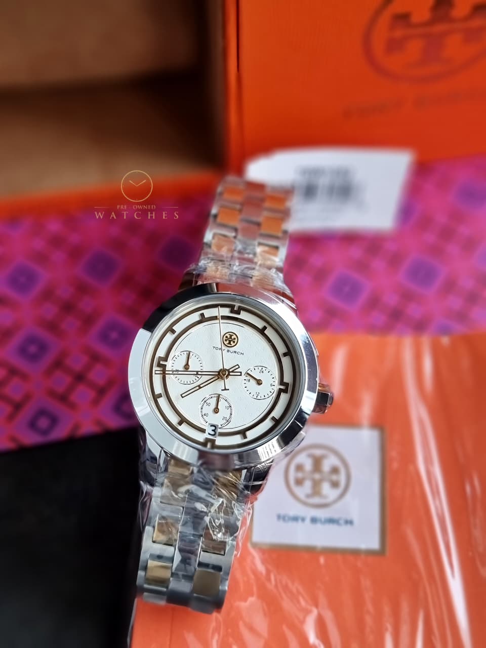 Tory Burch T-Monogram Two-Tone Stainless Steel Gold Dial Chronograph Quartz Watch For Ladies – TBW1052