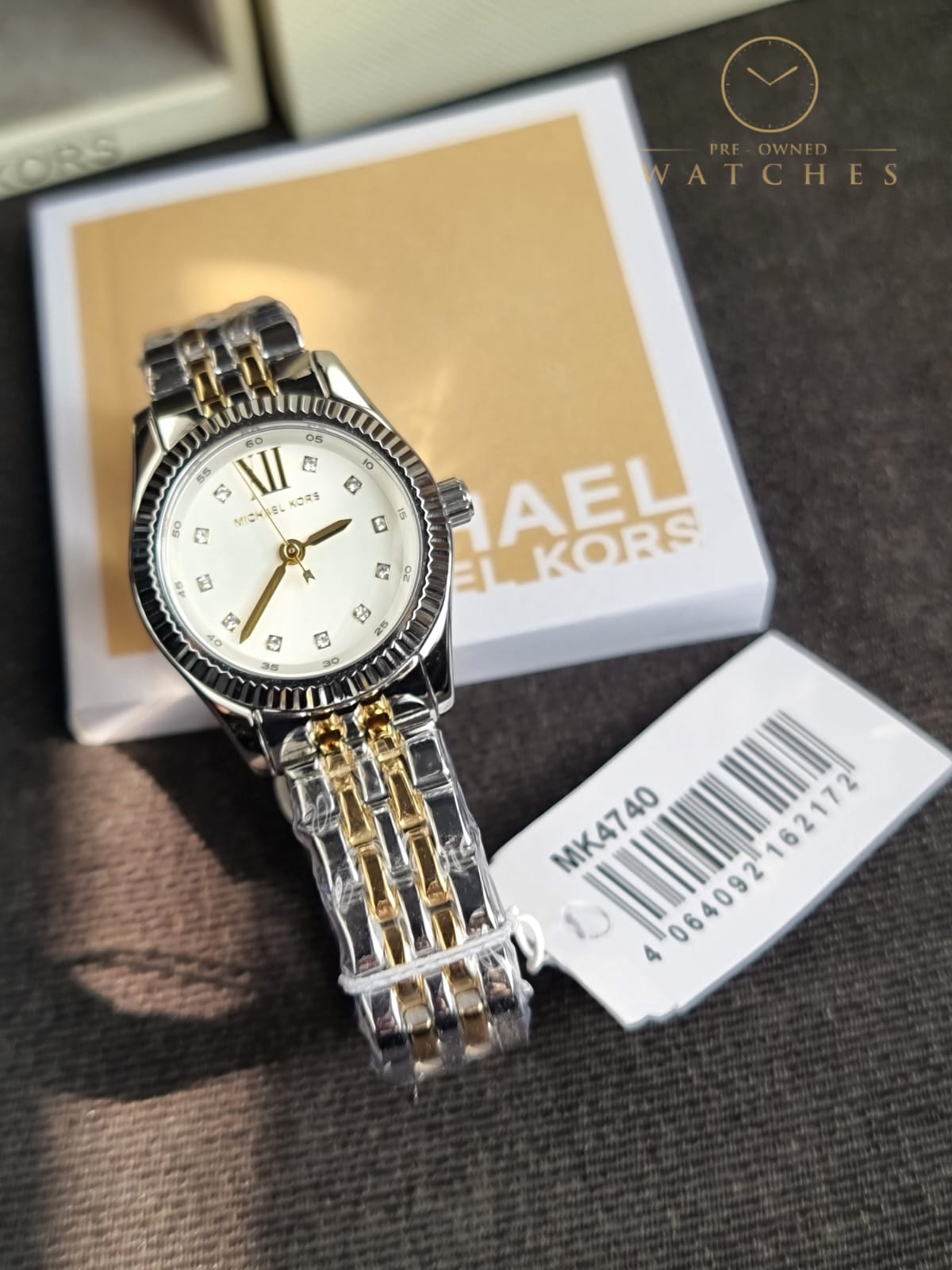 Michael Kors 
Lexington Quartz Crystal White Dial Two-Tone Ladies Watch
MK4740