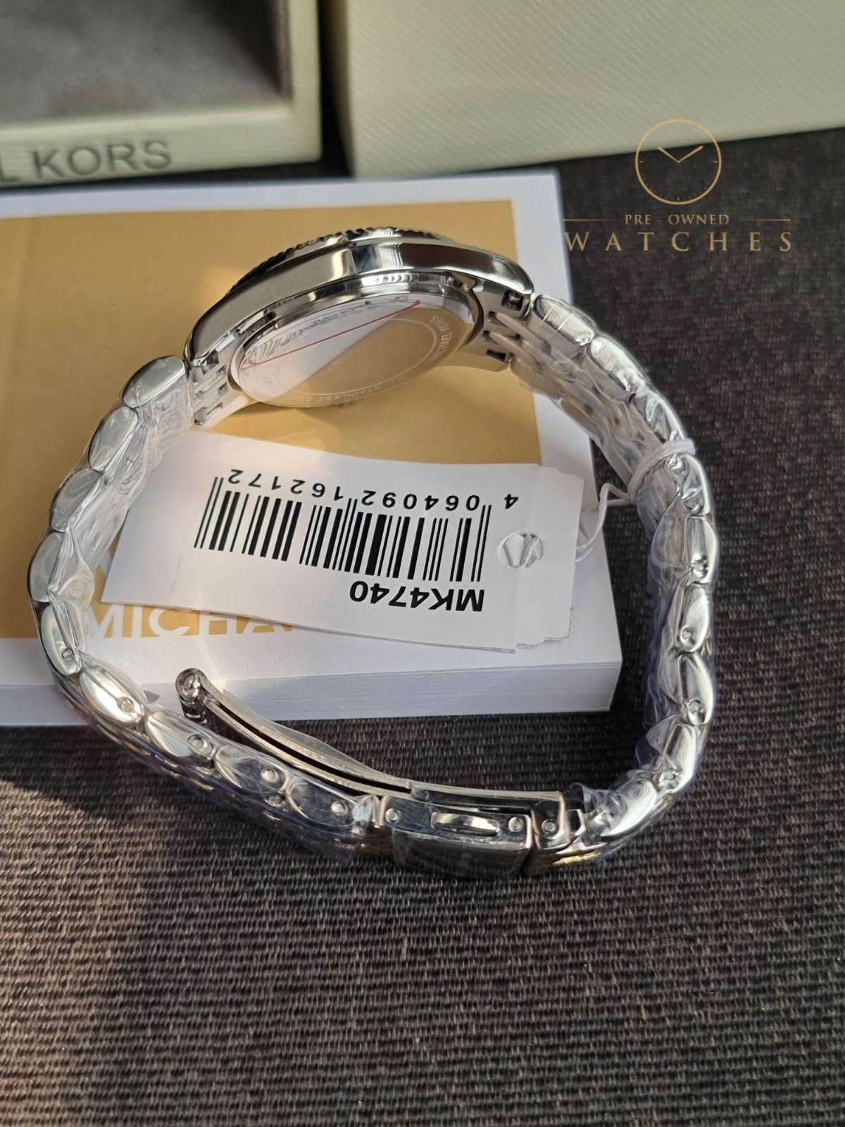 Michael Kors 
Lexington Quartz Crystal White Dial Two-Tone Ladies Watch
MK4740