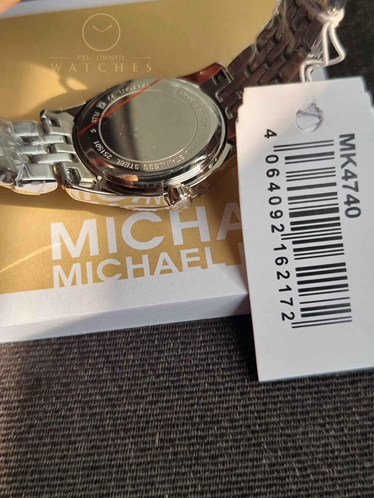 Michael Kors 
Lexington Quartz Crystal White Dial Two-Tone Ladies Watch
MK4740