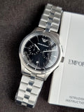 Emporio Armani Silver Stainless Steel Black 42mm Dial Chronograph Quartz Watch for Gents -  AR11691
(Without Tag)