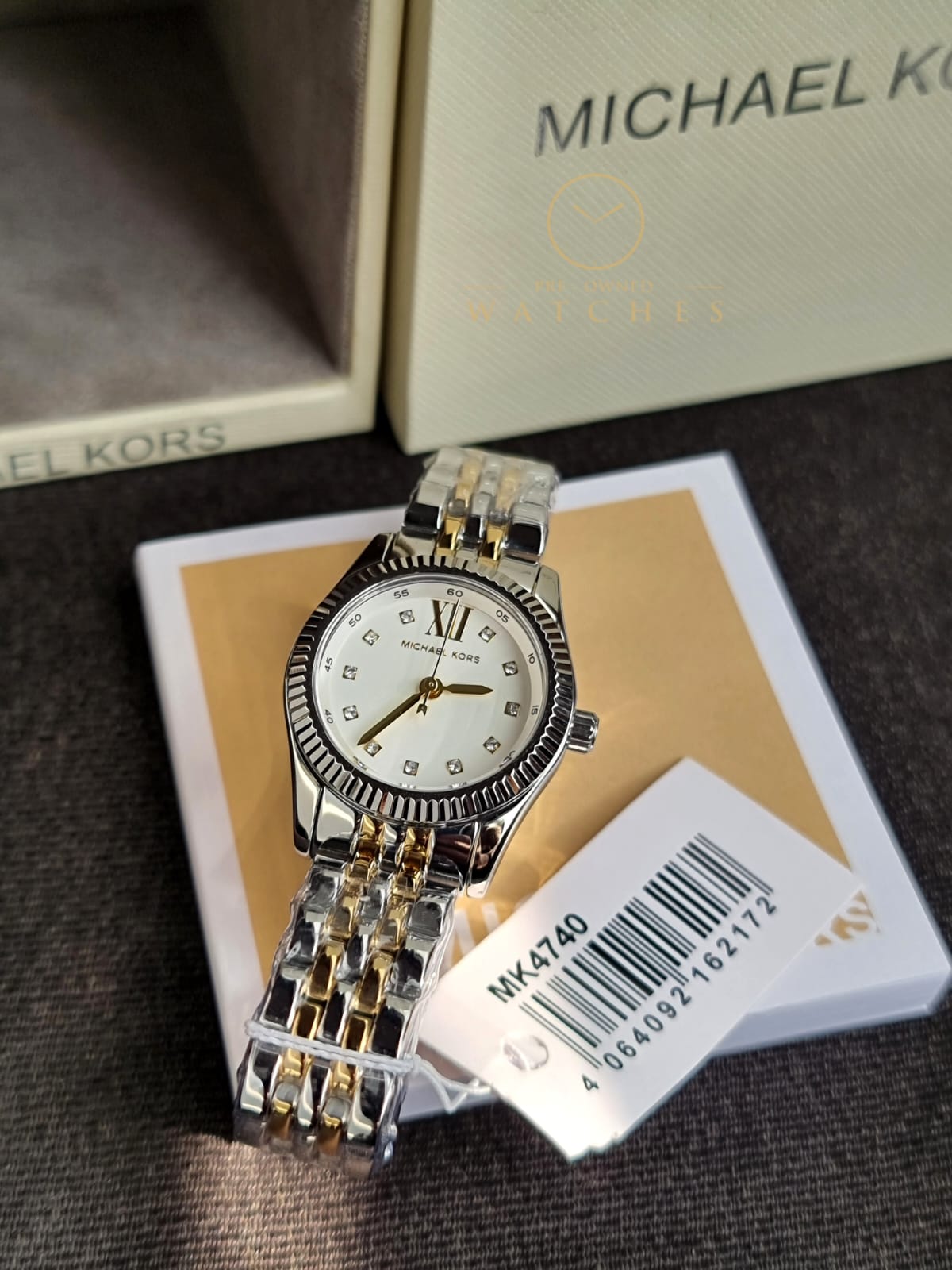 Michael Kors 
Lexington Quartz Crystal White Dial Two-Tone Ladies Watch
MK4740