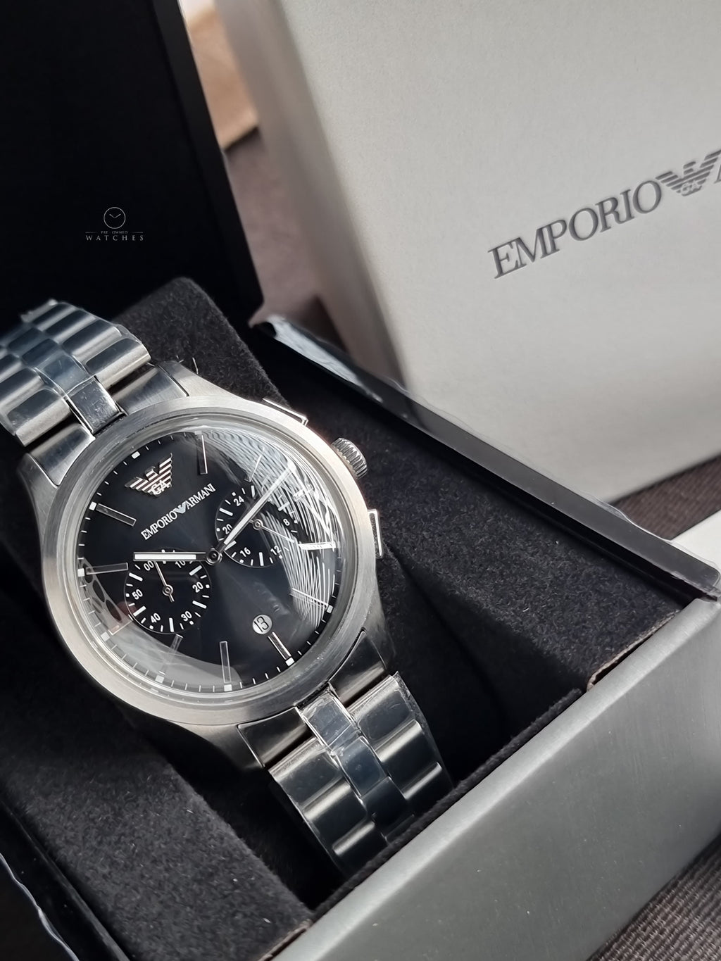 Emporio Armani Silver Stainless Steel Black 42mm Dial Chronograph Quartz Watch for Gents -  AR11691
(Without Tag)