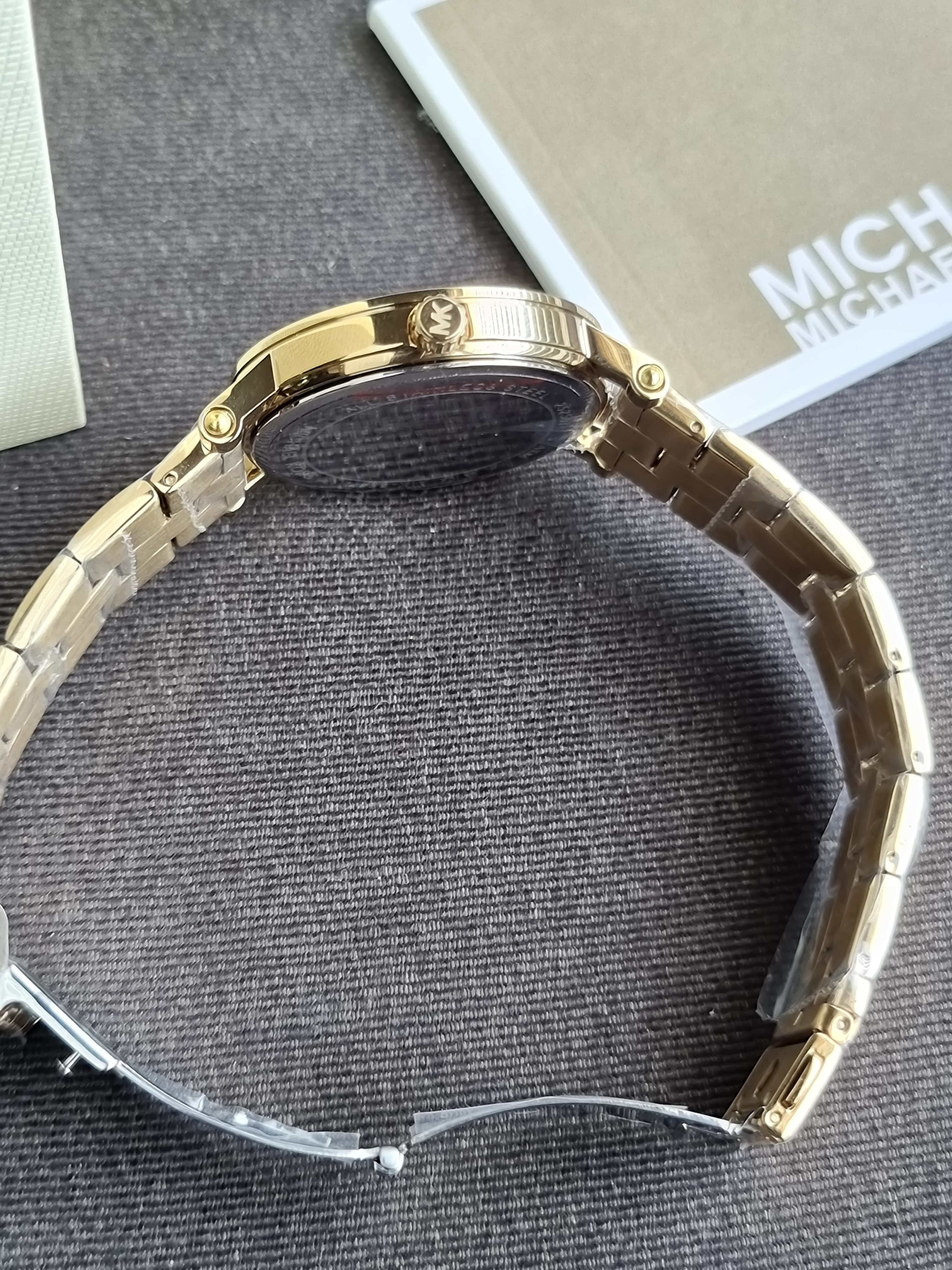 Michael Kors Women's Corey Three-Hand Gold-Tone Stainless Steel 38mm Watch 
MK7547