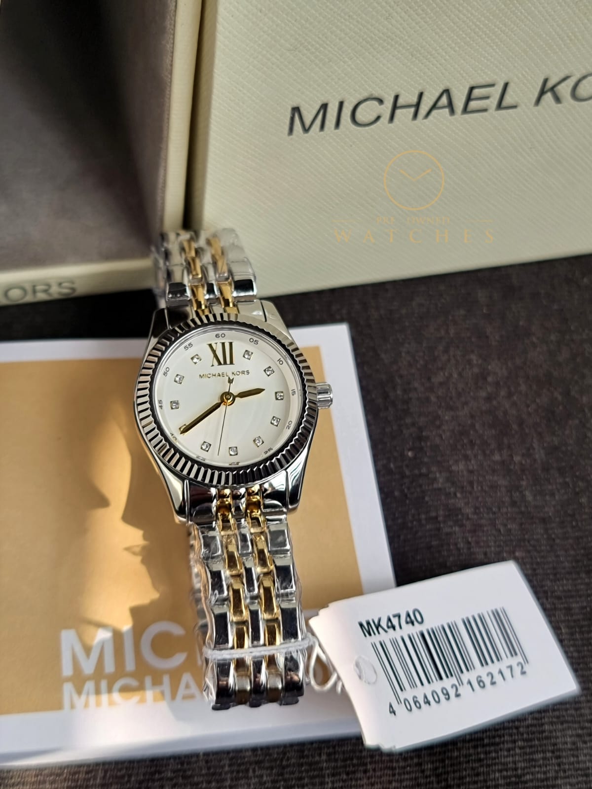 Michael Kors 
Lexington Quartz Crystal White Dial Two-Tone Ladies Watch
MK4740